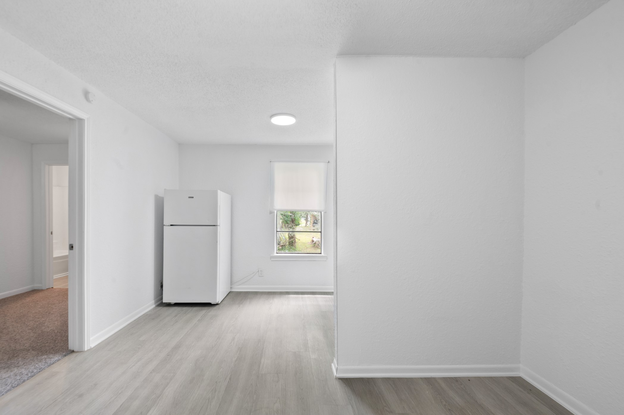 806 East Emily Avenue, Unit 1 Wharton, TX 77488 - Photo 22 of 32 a view of an empty room and window