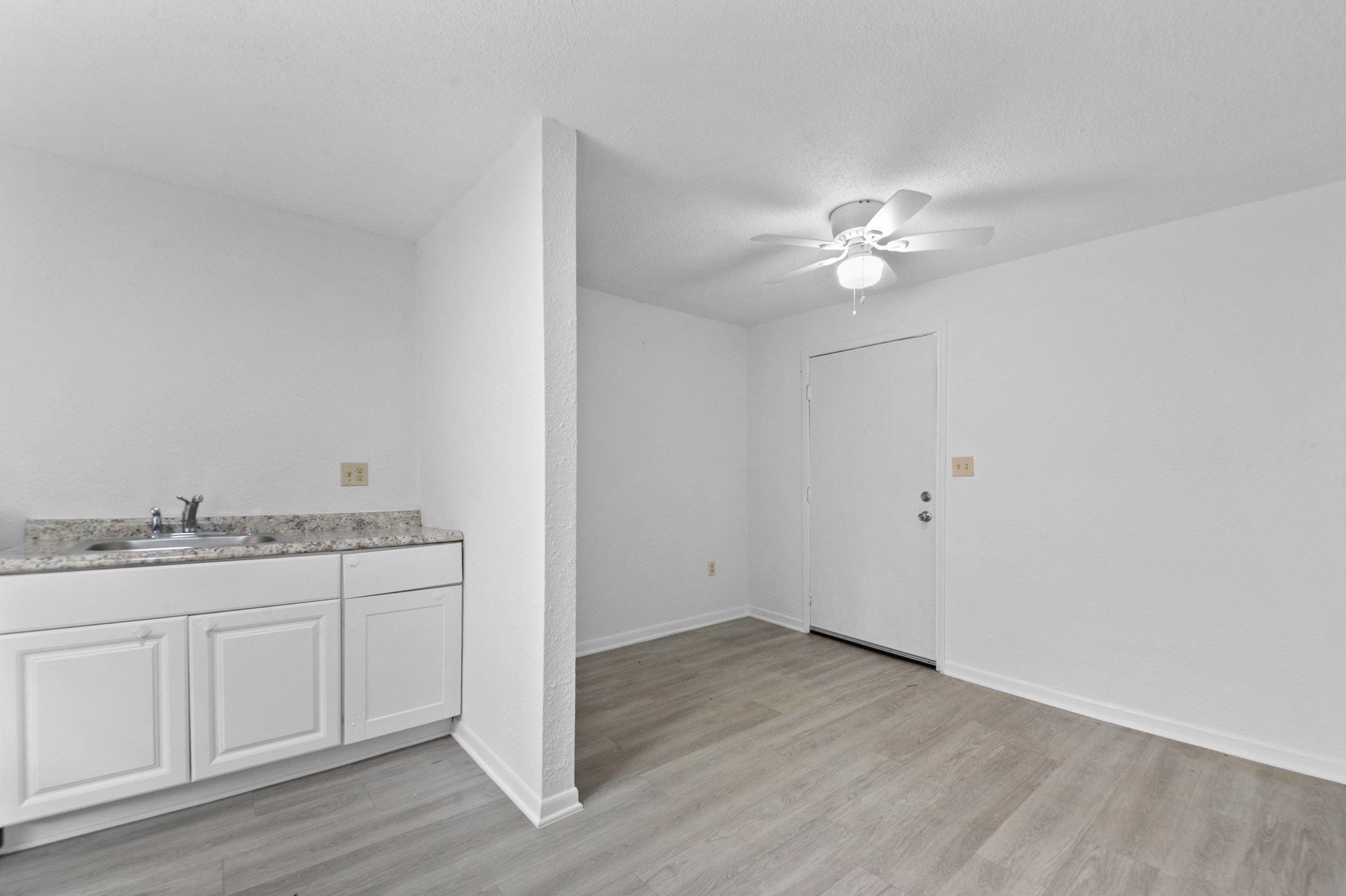 806 East Emily Avenue, Unit 1 Wharton, TX 77488 - Photo 26 of 32 a bathroom with a granite countertop sink vanity and a