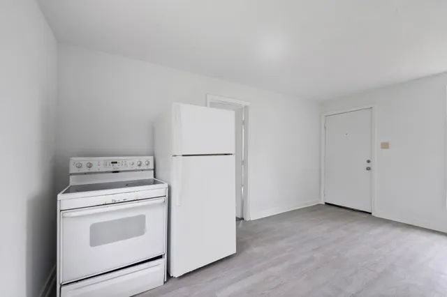 a view of a storage and utility room with washer and dryer