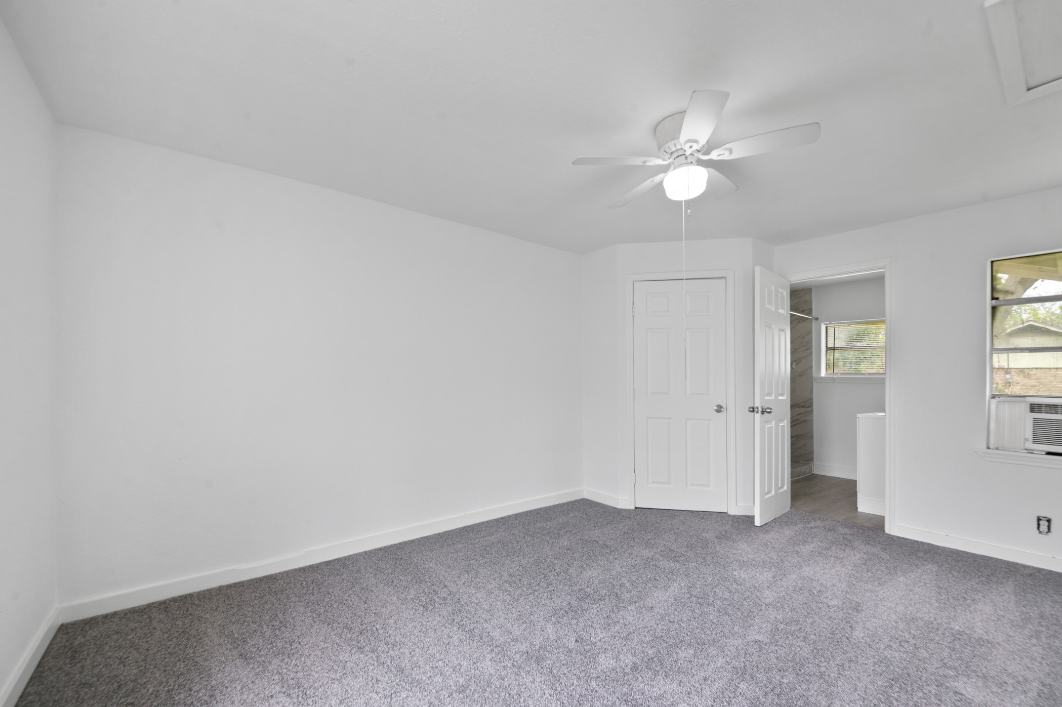 806 East Emily Avenue, Unit 1 Wharton, TX 77488 - Photo 6 of 32 wooden floor in an empty room with a window
