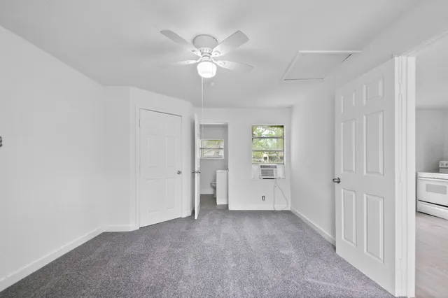 a view of an empty room with a window