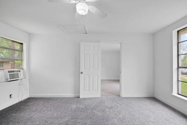 a view of an empty room with a window