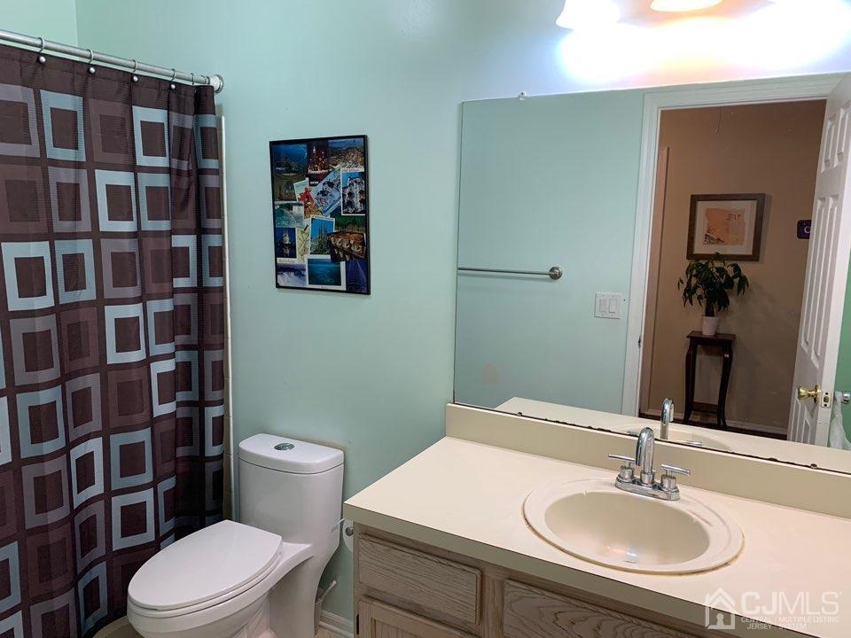41 Amboy Road Old Bridge, NJ 07747 - Photo 14 of 20 a bathroom with a sink toilet and shower