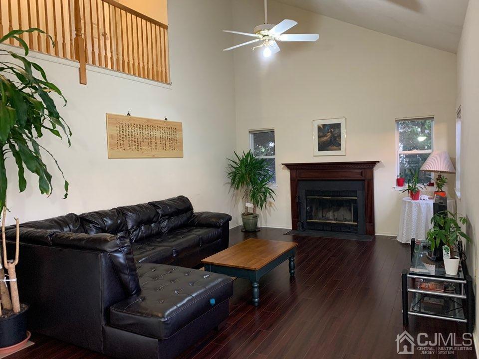 41 Amboy Road Old Bridge, NJ 07747 - Photo 7 of 20 a living room with furniture and a fireplace