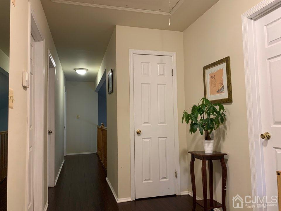 41 Amboy Road Old Bridge, NJ 07747 - Photo 9 of 20 a view of a hallway with wooden floor and closet area