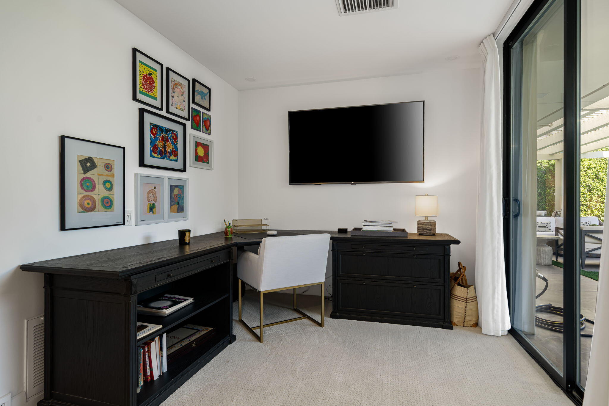 6 Exeter Court Rancho Mirage, CA 92270 - Photo 35 of 54 a living room with furniture and a flat screen tv