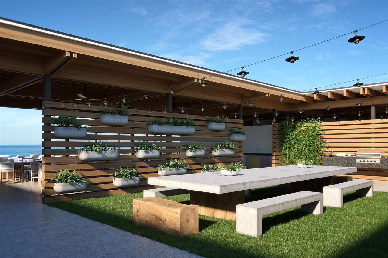 82 Kai Malu Drive, Unit 202 Kihei, HI 96753 - Photo 8 of 8 a view of a patio with table and chairs and potted plants