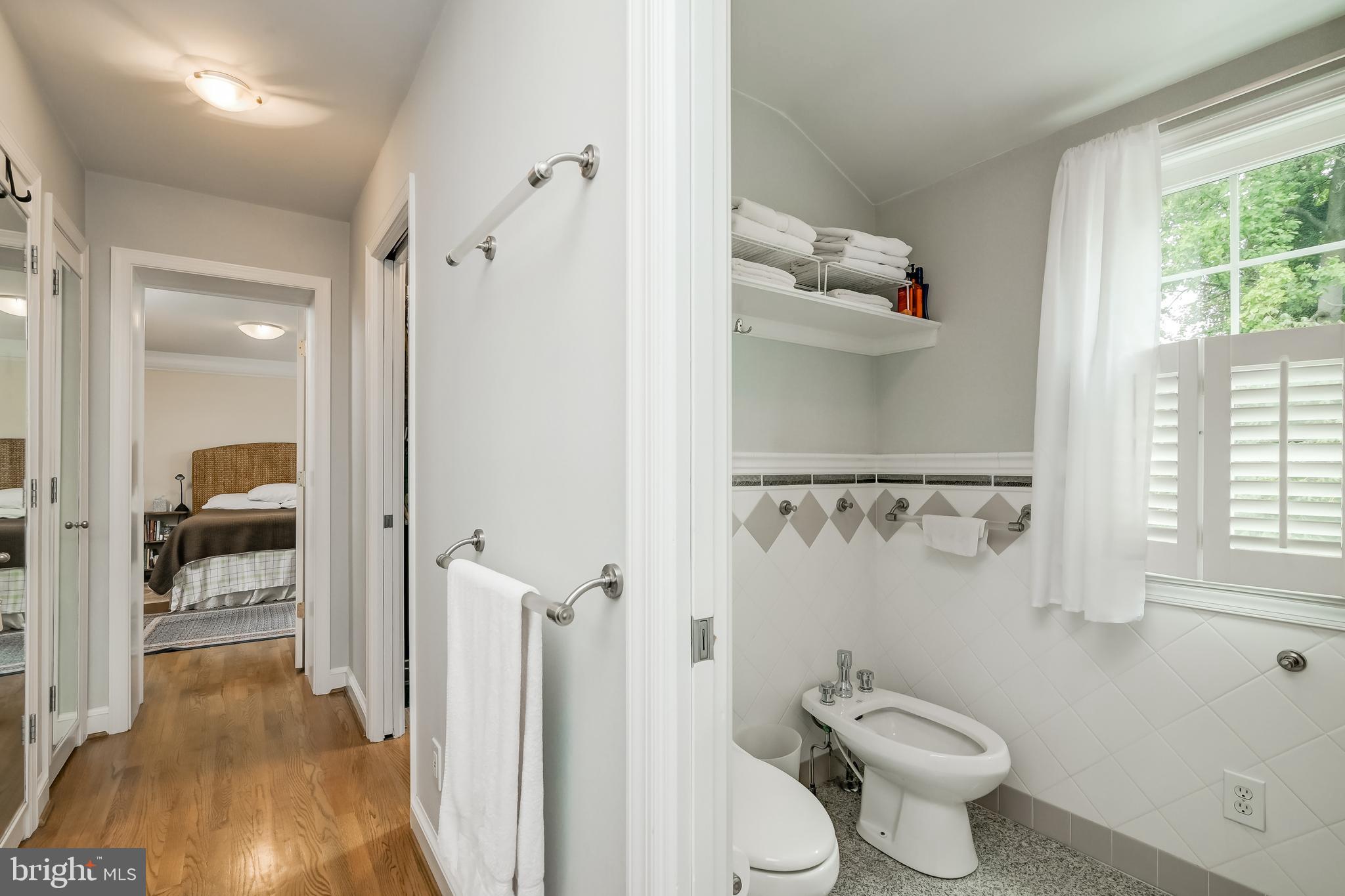 4606 Davidson Drive Chevy Chase, MD 20815 - Photo 12 of 26 a bathroom with a shower toilet and a sink