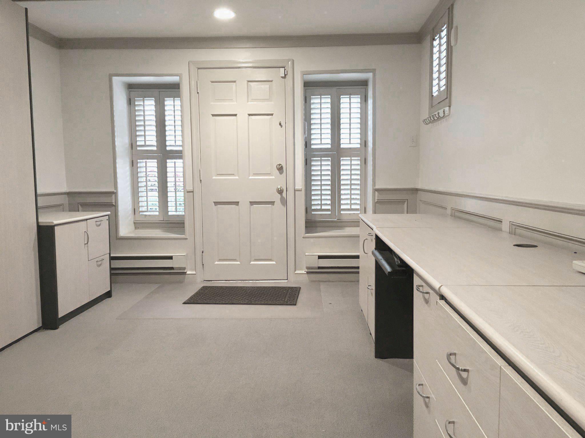 4606 Davidson Drive Chevy Chase, MD 20815 - Photo 20 of 26 an empty room with windows and cabinet