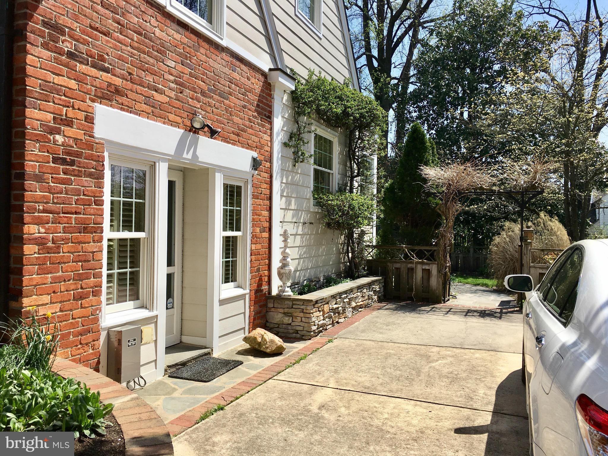 4606 Davidson Drive Chevy Chase, MD 20815 - Photo 23 of 26 a view of a patio with table and chairs and potted plants