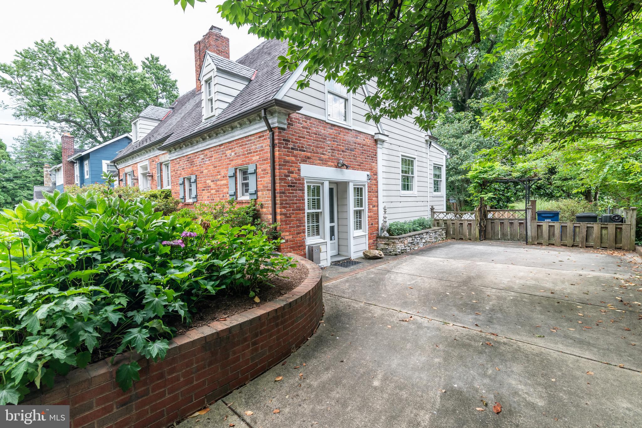 4606 Davidson Drive Chevy Chase, MD 20815 - Photo 24 of 26 a view of a house with a yard and potted plants