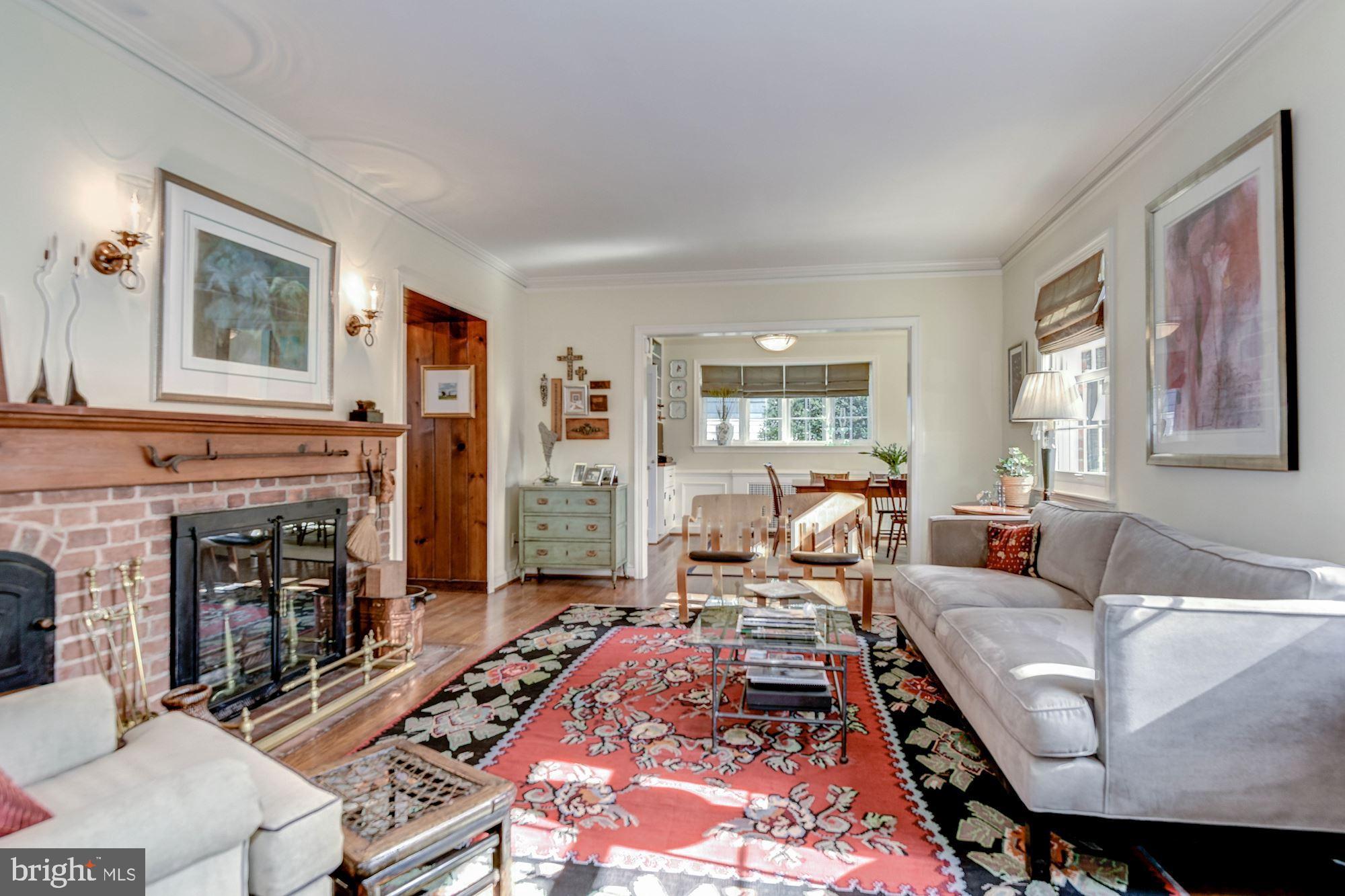 4606 Davidson Drive Chevy Chase, MD 20815 - Photo 3 of 26 a living room with furniture and a fireplace