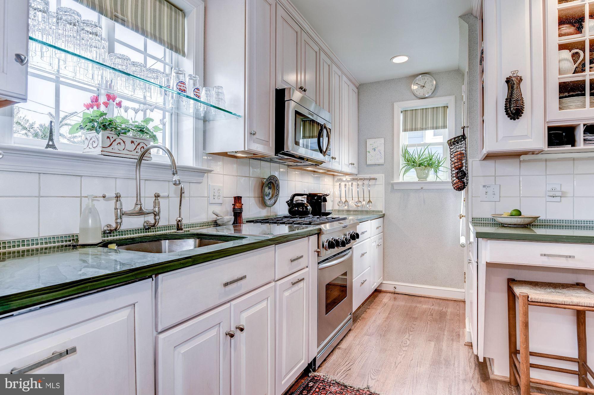 4606 Davidson Drive Chevy Chase, MD 20815 - Photo 5 of 26 a kitchen with stainless steel appliances granite countertop a sink a stove and a wooden floors
