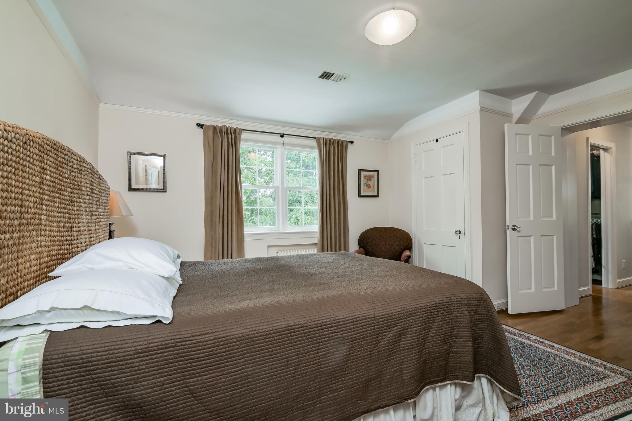 4606 Davidson Drive Chevy Chase, MD 20815 - Photo 10 of 26 a bedroom with a bed and a large window