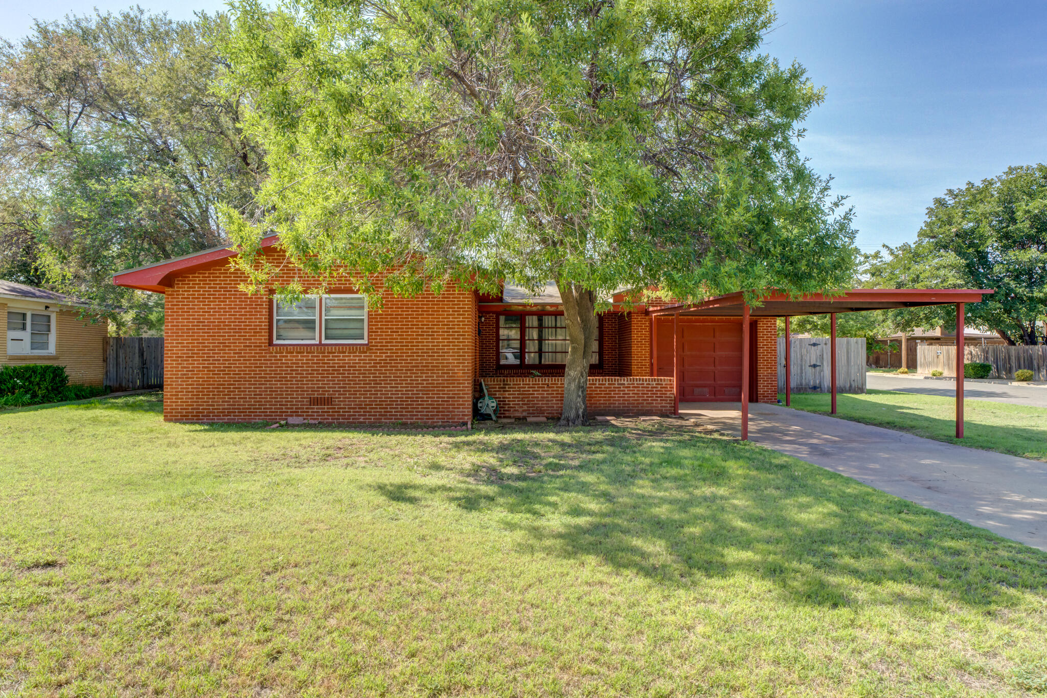 a house that has a tree in front of it
