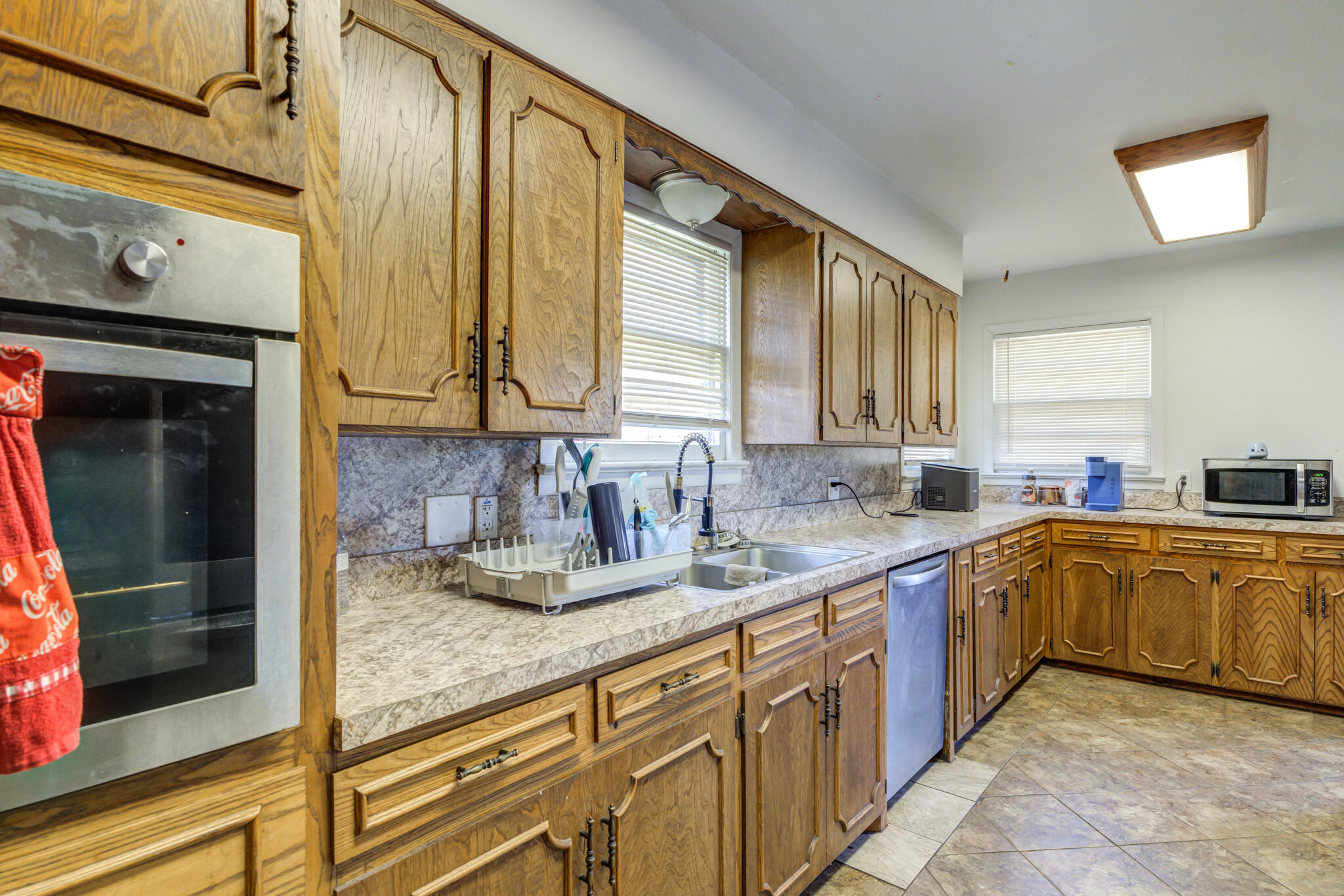 3615 37th Street Lubbock, TX 79413 - Photo 13 of 27 a kitchen with stainless steel appliances granite countertop a sink and cabinets