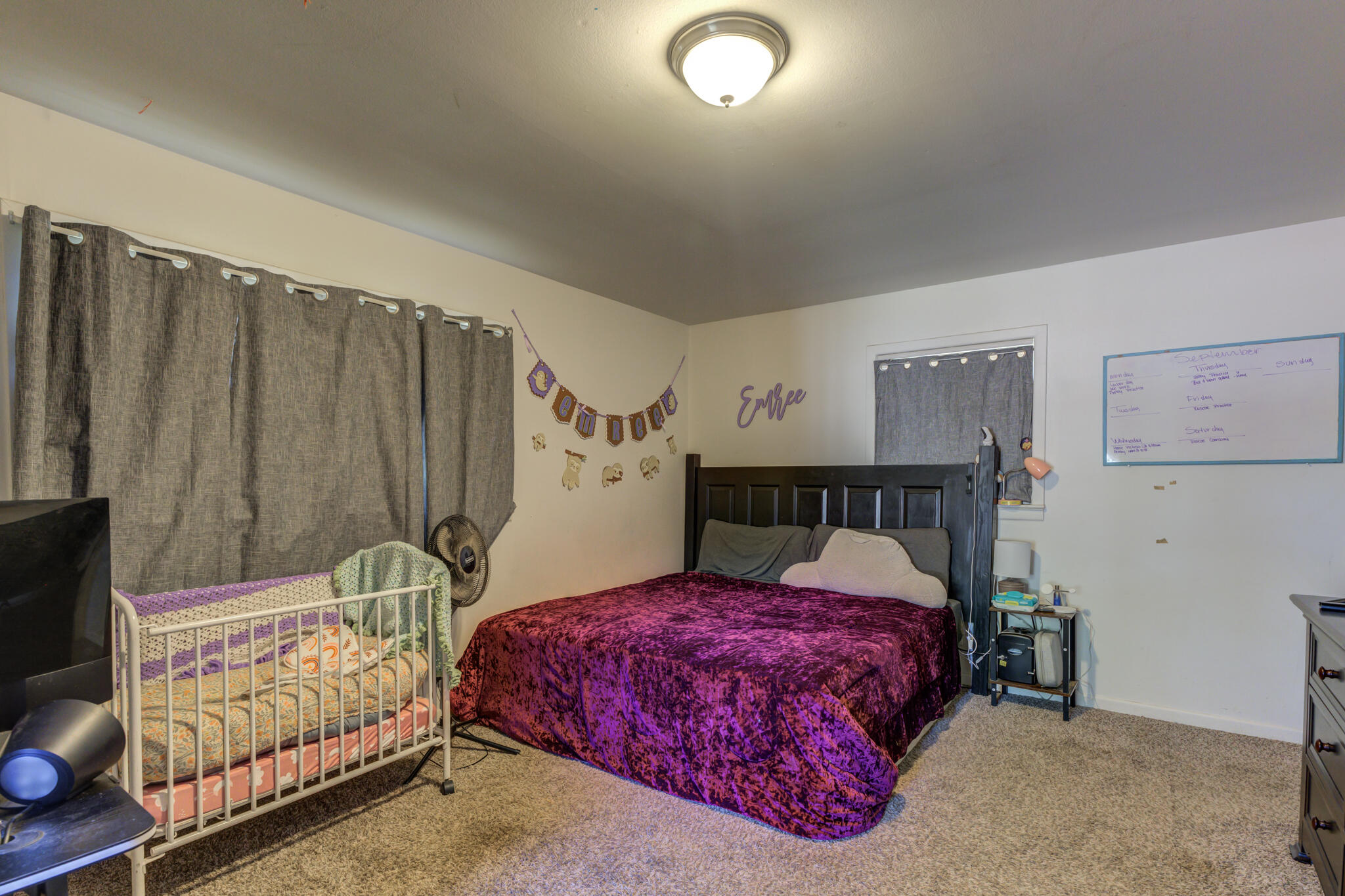 3615 37th Street Lubbock, TX 79413 - Photo 19 of 27 a bedroom with a bed and a mirror
