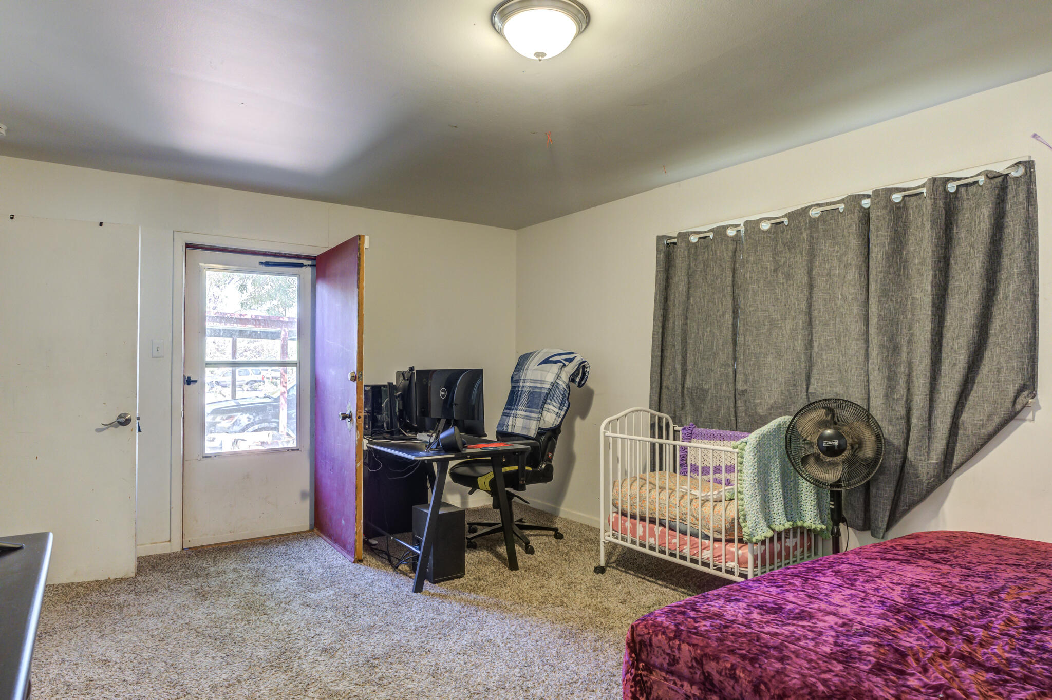 3615 37th Street Lubbock, TX 79413 - Photo 21 of 27 a view of a workspace with furniture and a window