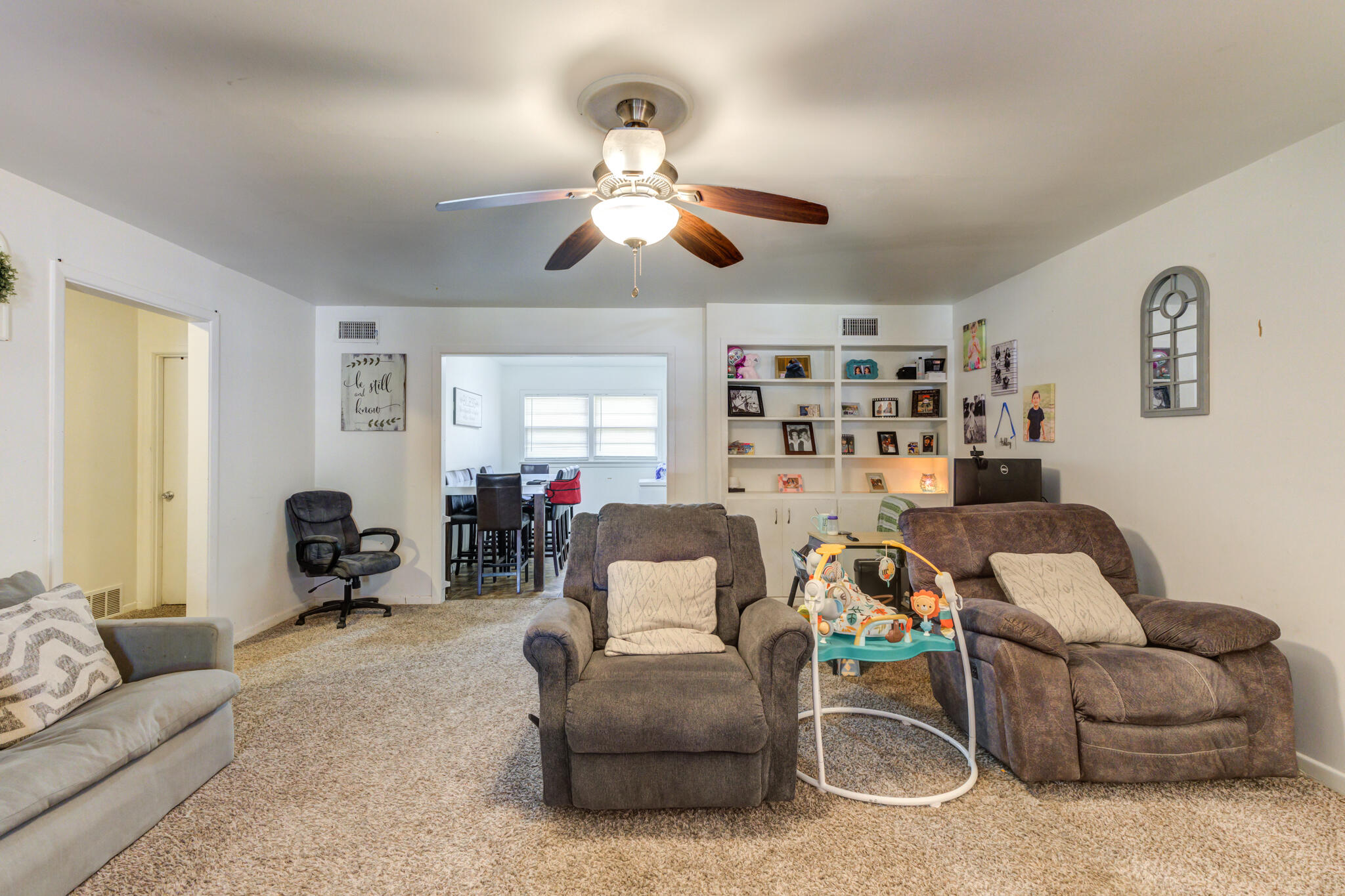 3615 37th Street Lubbock, TX 79413 - Photo 5 of 27 a living room with furniture and a large window