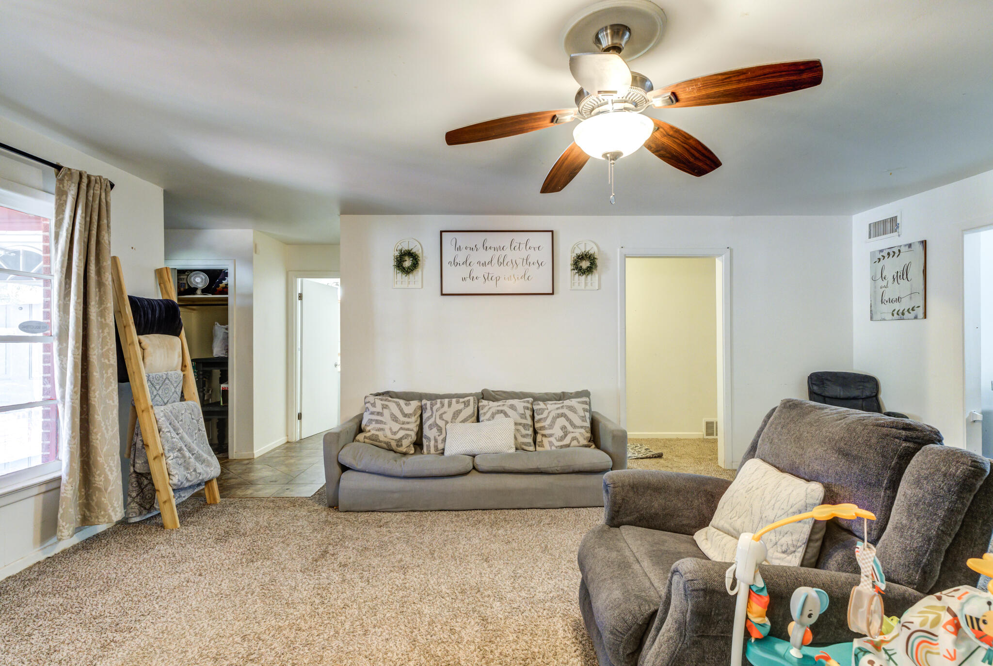 3615 37th Street Lubbock, TX 79413 - Photo 7 of 27 a living room with furniture and a ceiling fan