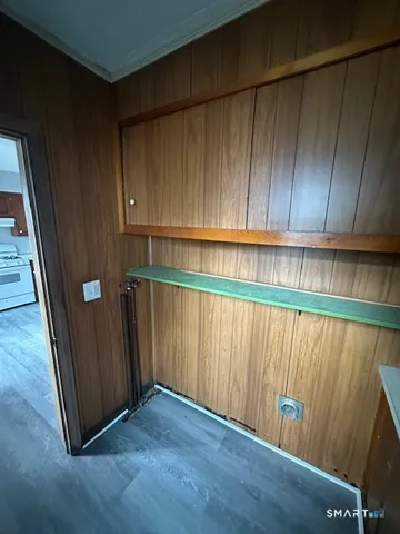 an empty room with wooden floor