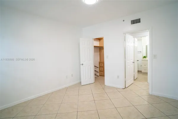 a kitchen with white cabinets and a sink