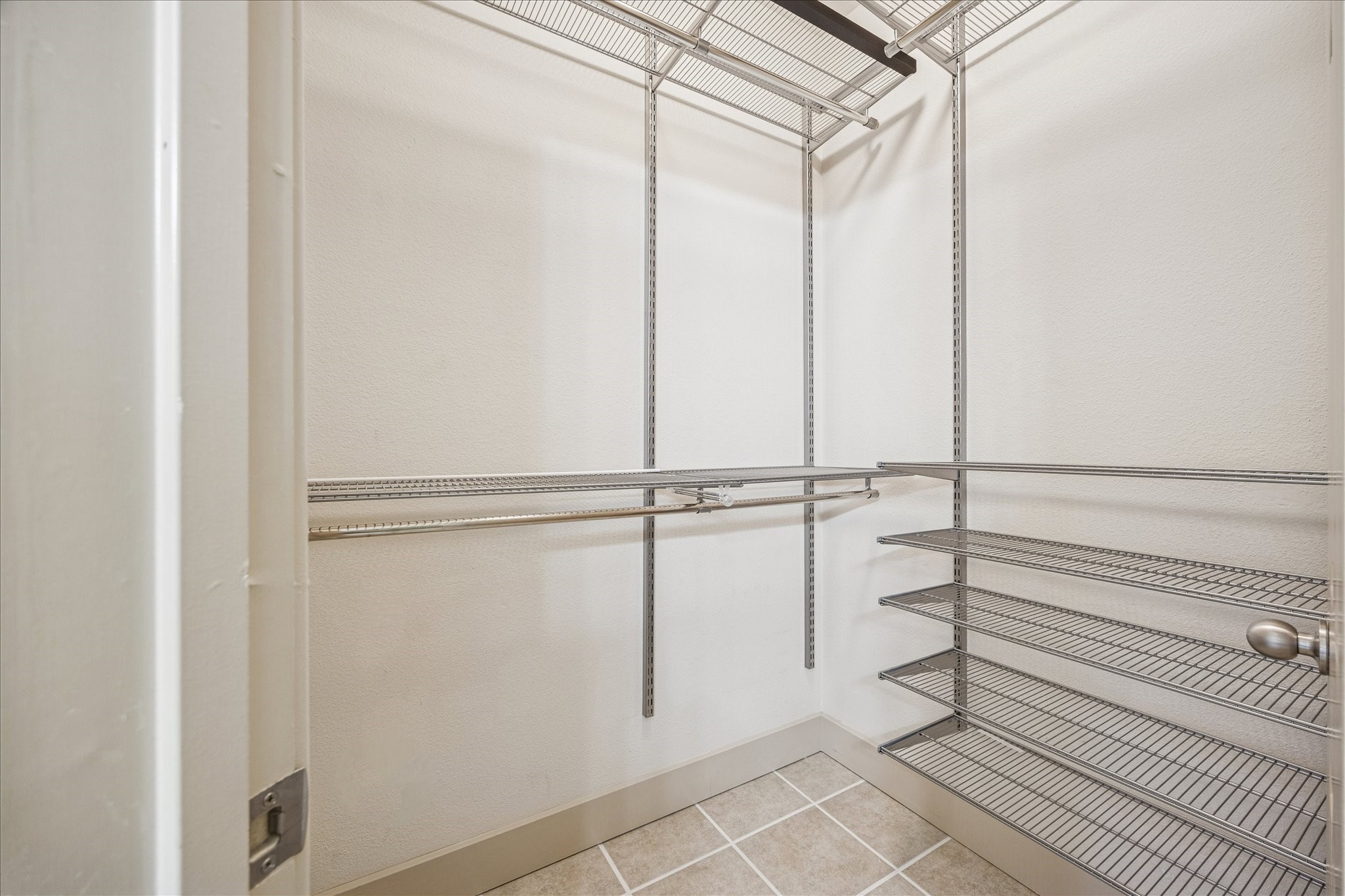 1620 Elgin Street, Unit 9 Houston, TX 77004 - Photo 12 of 28 a view of a room with rack on the wall and a shower