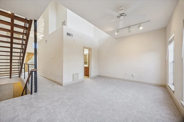 a view of an empty room with a fireplace