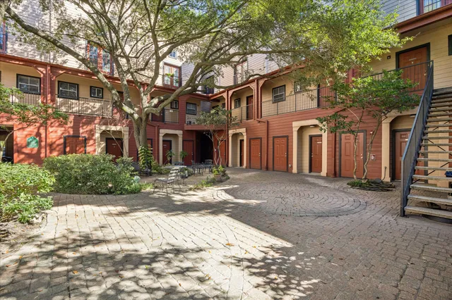 a view of a balcony with wooden floor