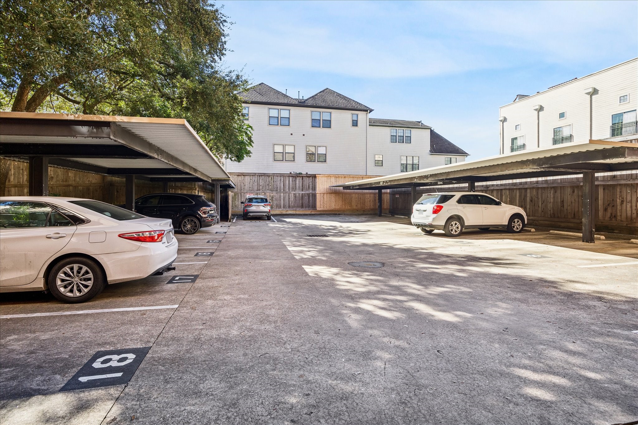 1620 Elgin Street, Unit 9 Houston, TX 77004 - Photo 23 of 28 a car parked in front of a white house