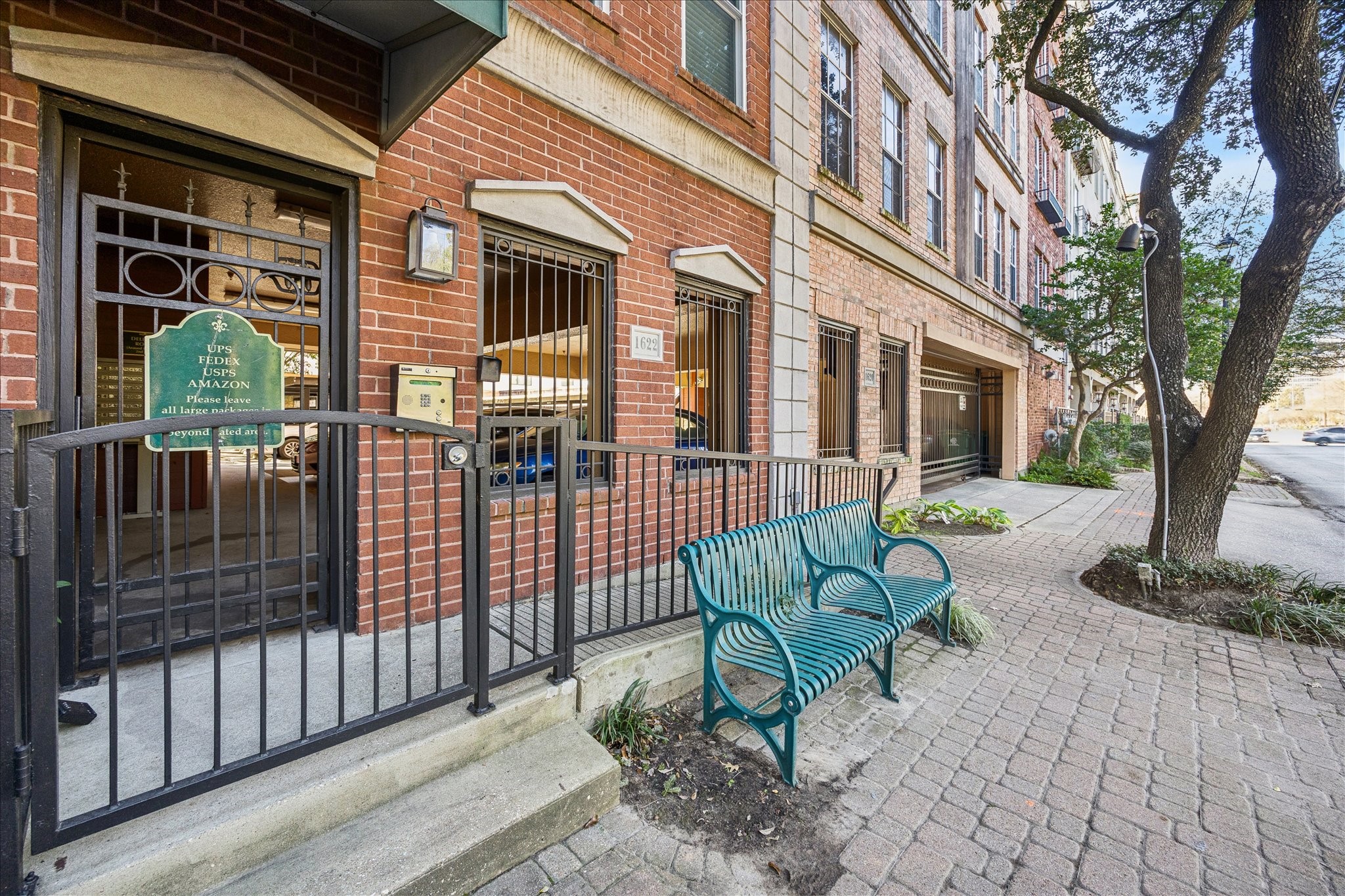1620 Elgin Street, Unit 9 Houston, TX 77004 - Photo 25 of 28 a view of a brick building with a bench and floor