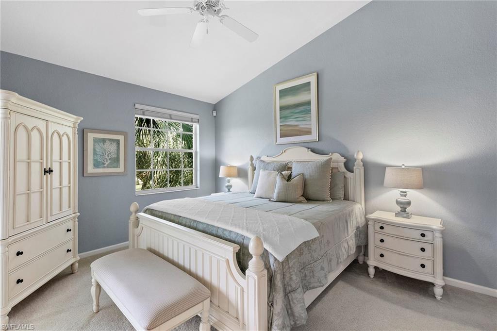 7132 Timberland Circle, Unit 201 Naples, FL 34109 - Photo 15 of 46 a bedroom with a bed and a window