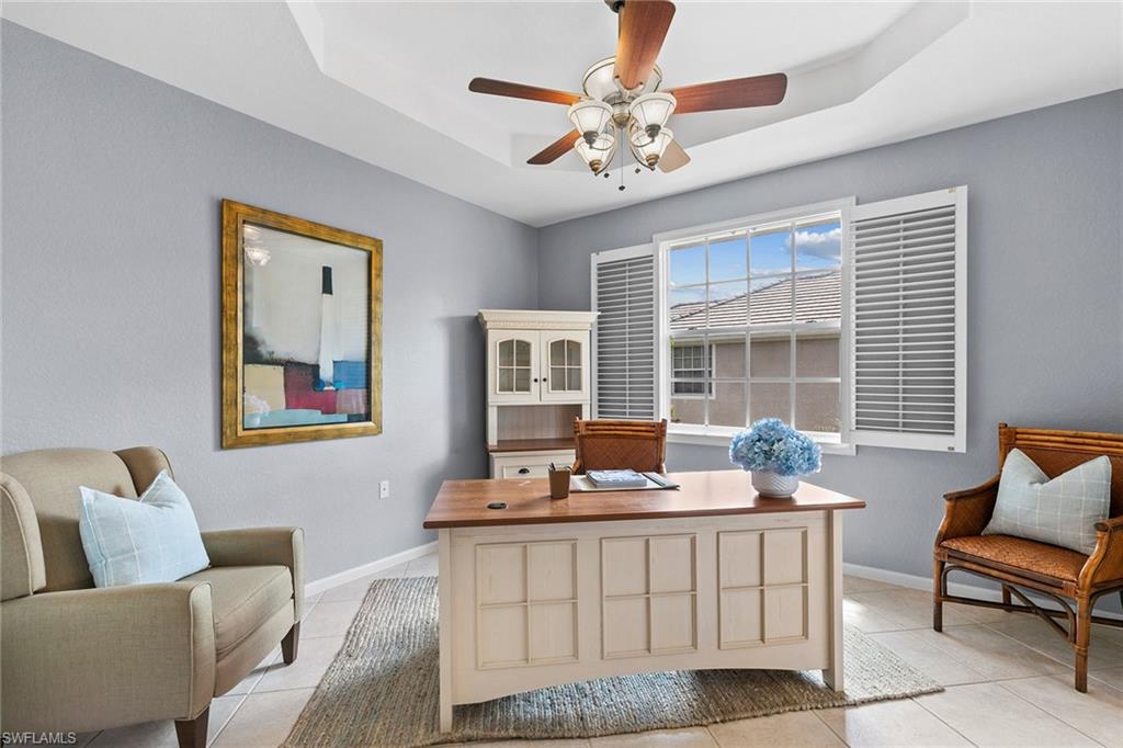 7132 Timberland Circle, Unit 201 Naples, FL 34109 - Photo 22 of 46 a living room with furniture and a large window