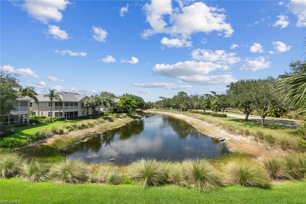 7132 Timberland Circle, Unit 201 Naples, FL 34109 - Photo 26 of 46 a view of residential houses with outdoor space lake view and boat