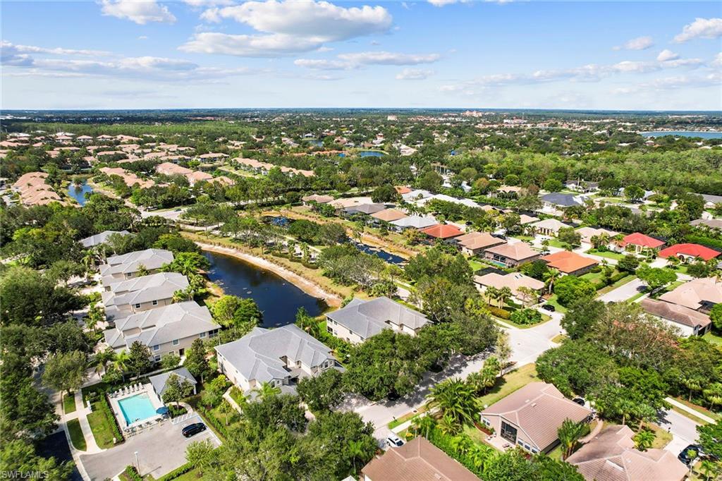 7132 Timberland Circle, Unit 201 Naples, FL 34109 - Photo 32 of 46 an aerial view of residential houses with outdoor space