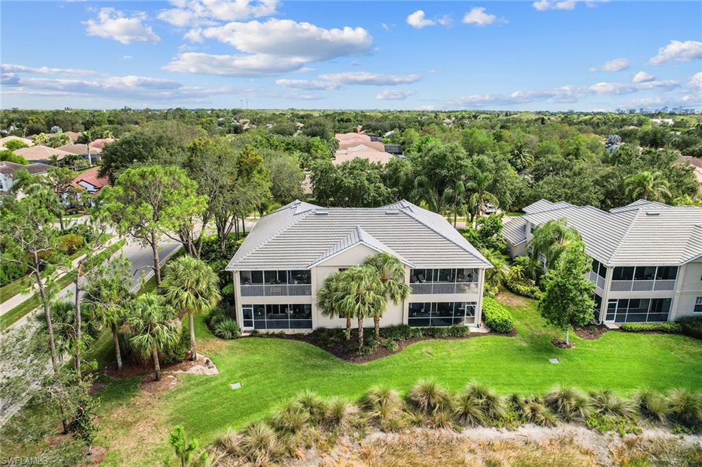 7132 Timberland Circle, Unit 201 Naples, FL 34109 - Photo 34 of 46 an aerial view of a house with garden