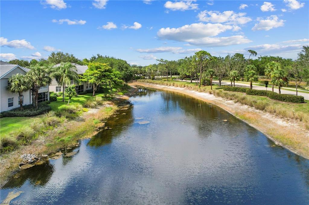 7132 Timberland Circle, Unit 201 Naples, FL 34109 - Photo 35 of 46 a view of a lake with houses