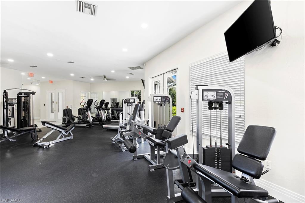 7132 Timberland Circle, Unit 201 Naples, FL 34109 - Photo 40 of 46 a view of a room with gym equipment