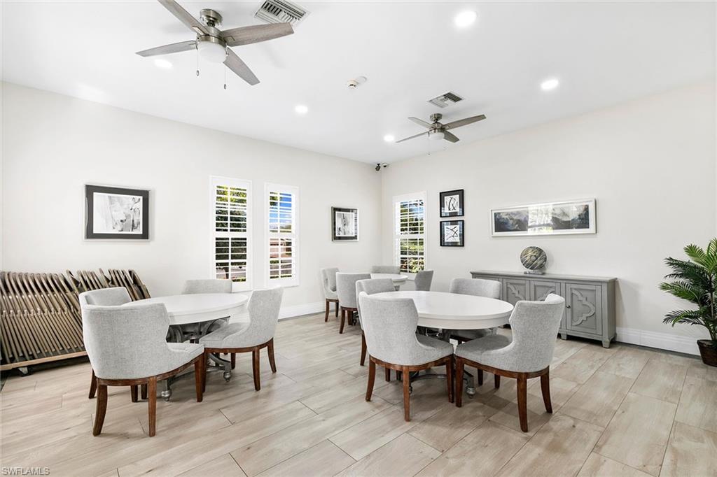 7132 Timberland Circle, Unit 201 Naples, FL 34109 - Photo 42 of 46 a view of a dining room with furniture and window