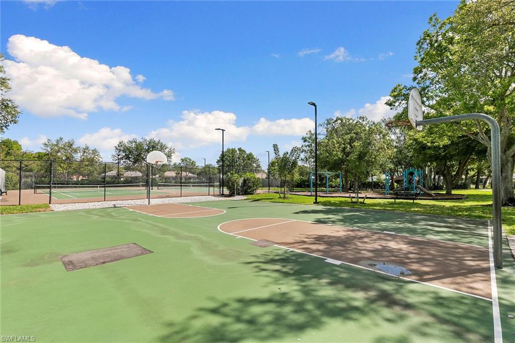 7132 Timberland Circle, Unit 201 Naples, FL 34109 - Photo 44 of 46 a view of a playground ground and trees