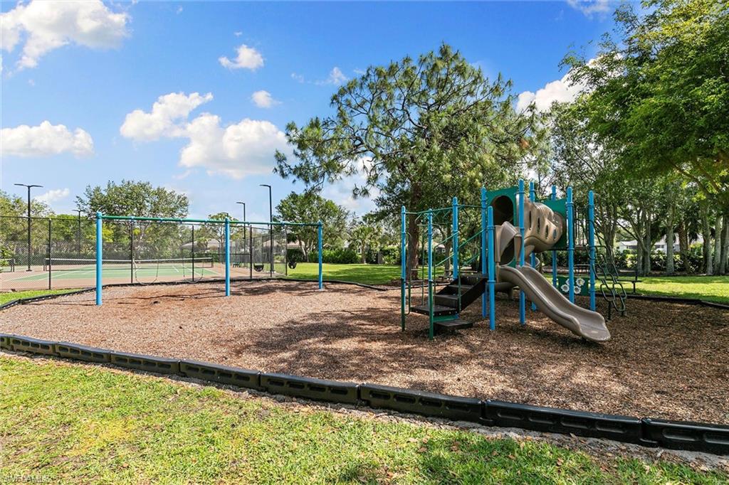 7132 Timberland Circle, Unit 201 Naples, FL 34109 - Photo 45 of 46 a view of a park with swings