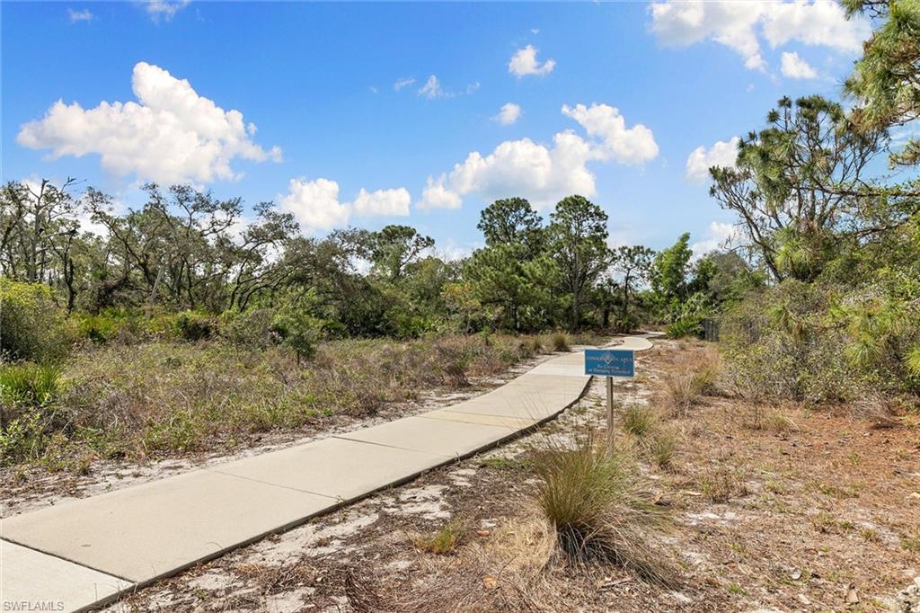 7132 Timberland Circle, Unit 201 Naples, FL 34109 - Photo 46 of 46 a view of a yard with an outdoor space