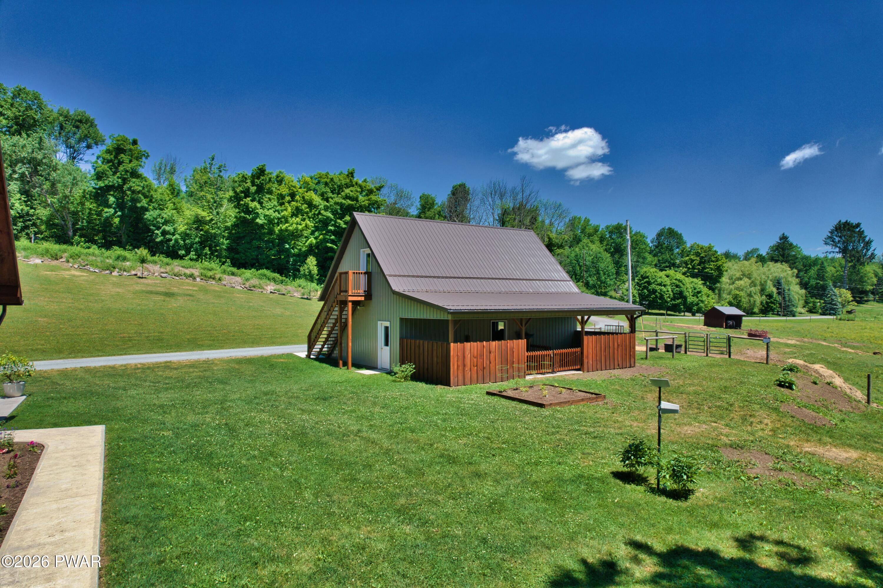 149 Sheards Road Milanville, PA 18443 - Photo 17 of 57 a house view with a garden space