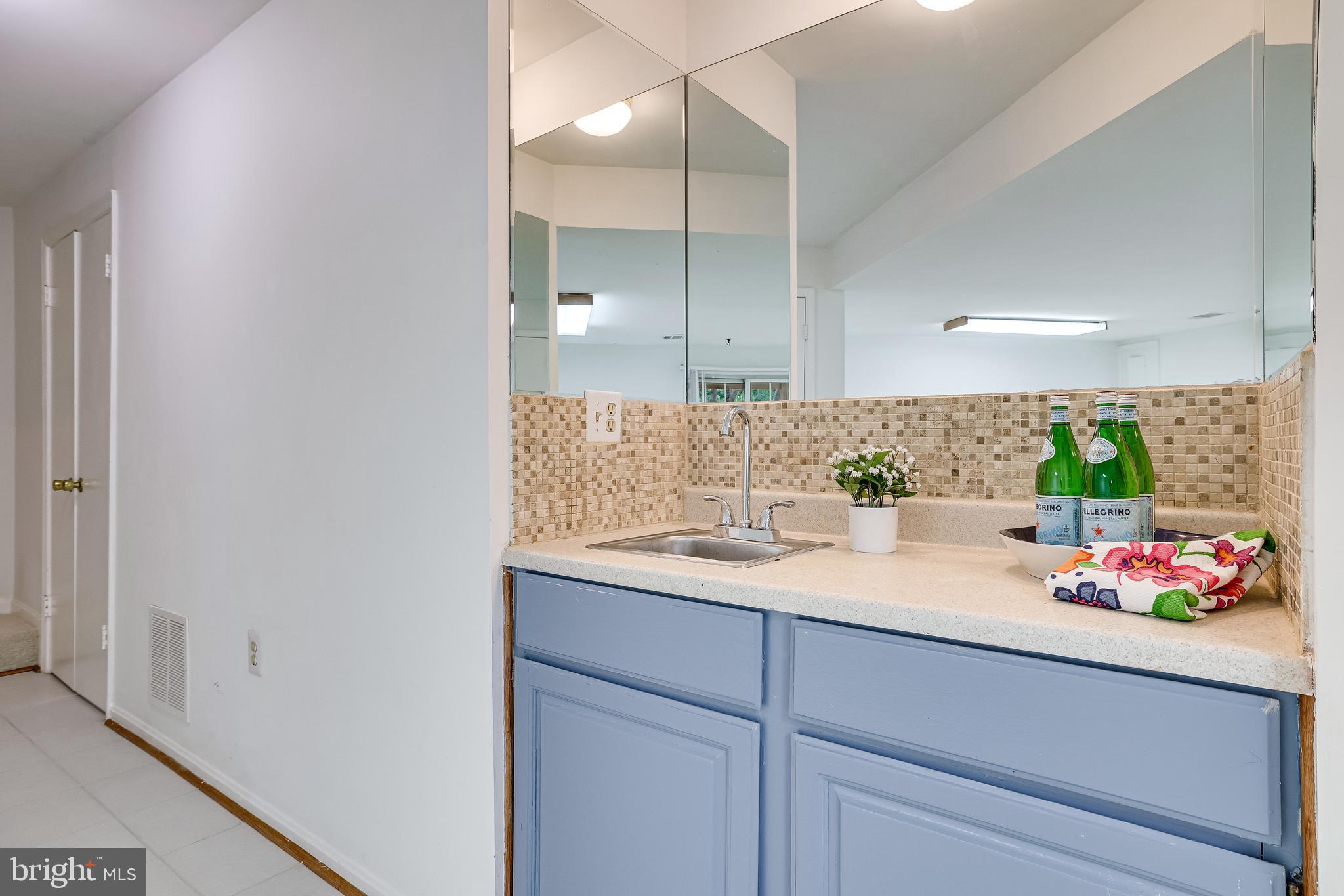 11962 Sentinel Point Court Reston, VA 20191 - Photo 48 of 62 The wet bar also has walls of mirrors.