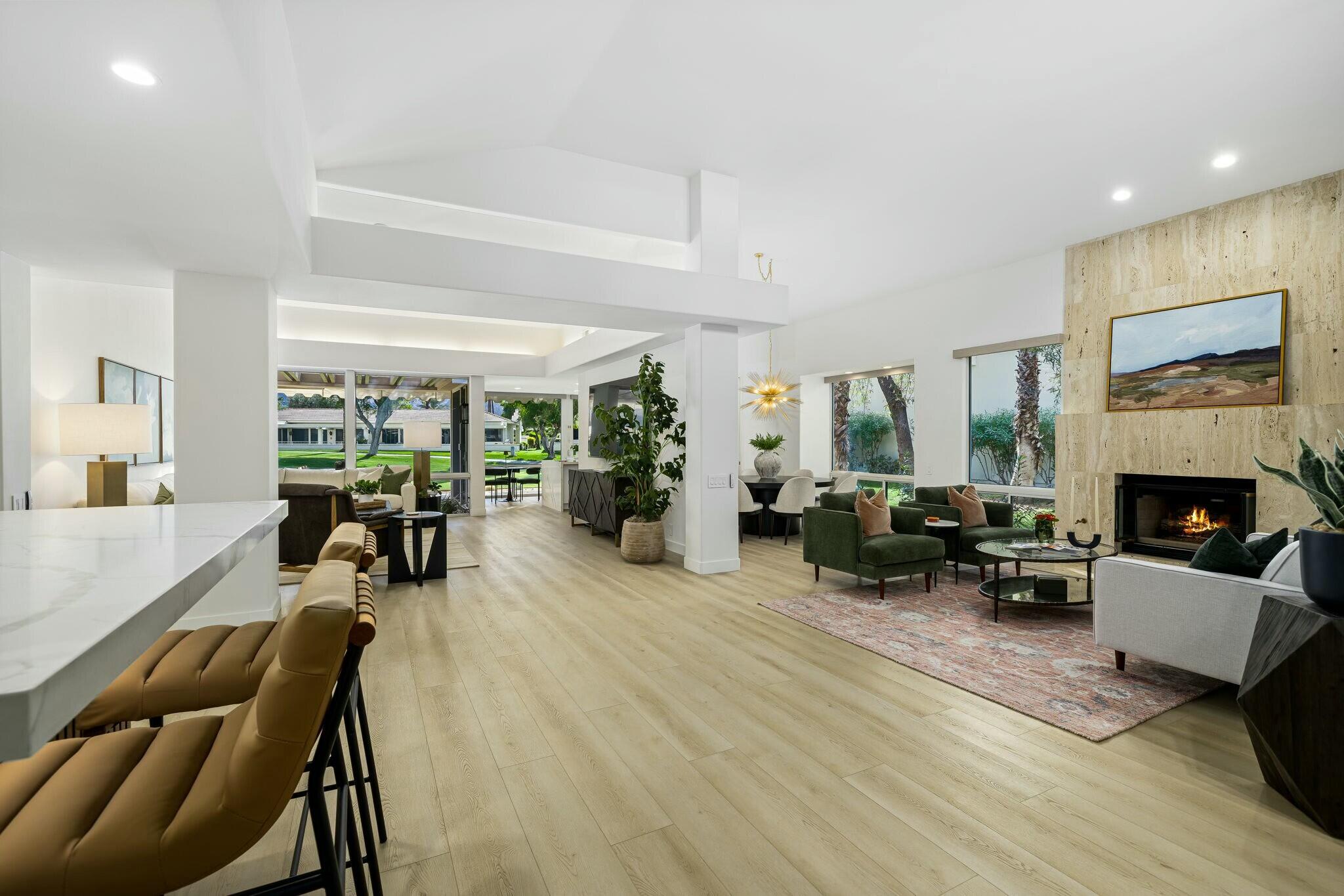 75405 Riviera Drive Indian Wells, CA 92210 - Photo 11 of 43 a living room with furniture fireplace and a window
