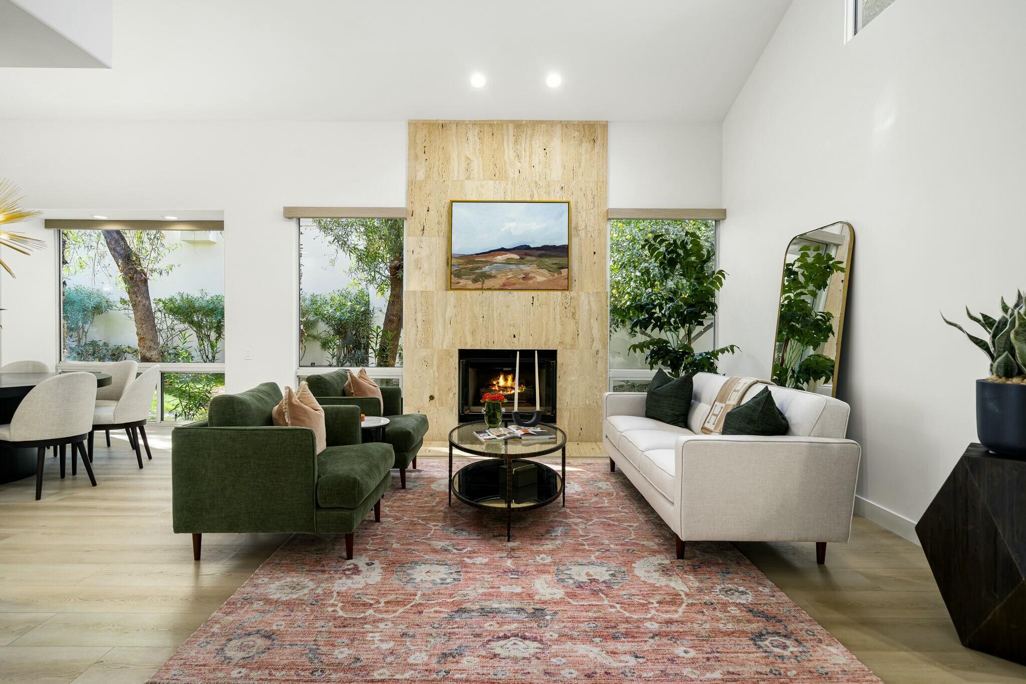 75405 Riviera Drive Indian Wells, CA 92210 - Photo 12 of 43 a living room with furniture and a fireplace