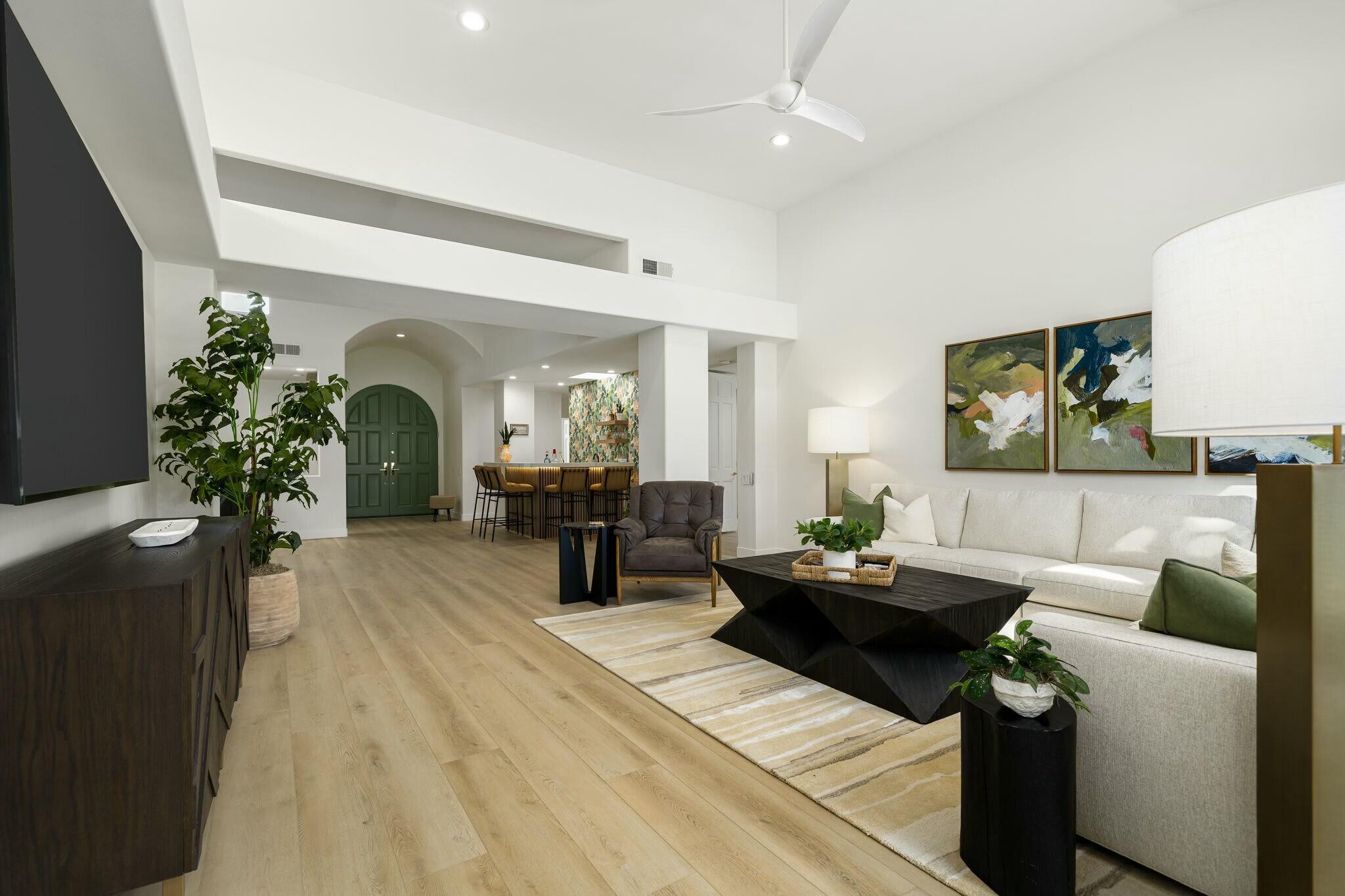 75405 Riviera Drive Indian Wells, CA 92210 - Photo 14 of 43 a living room with furniture and a potted plant