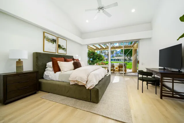 a bed room with a bed and a television