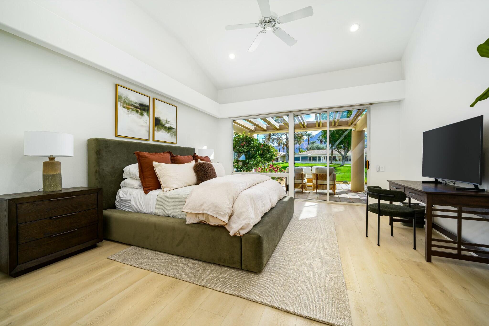 75405 Riviera Drive Indian Wells, CA 92210 - Photo 23 of 43 a bed room with a bed and a television