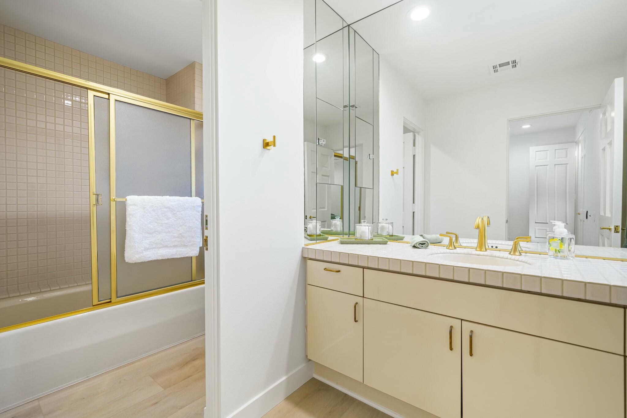 75405 Riviera Drive Indian Wells, CA 92210 - Photo 28 of 43 a bathroom with a double vanity sink and mirror